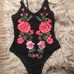 Sheer embroidered body suit.